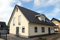 Zweifamilienhaus Marl Duisburg, Haus mit Einliegerwohnung in NRW, Tonnendachgaube, Zink Verkleidung Giebelseiten und Traufenseiten