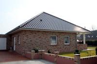 Massivhaus Bungalow Niederrhein Mittelrhein, massive Garage, Klinkerbau, berdachte Terrasse